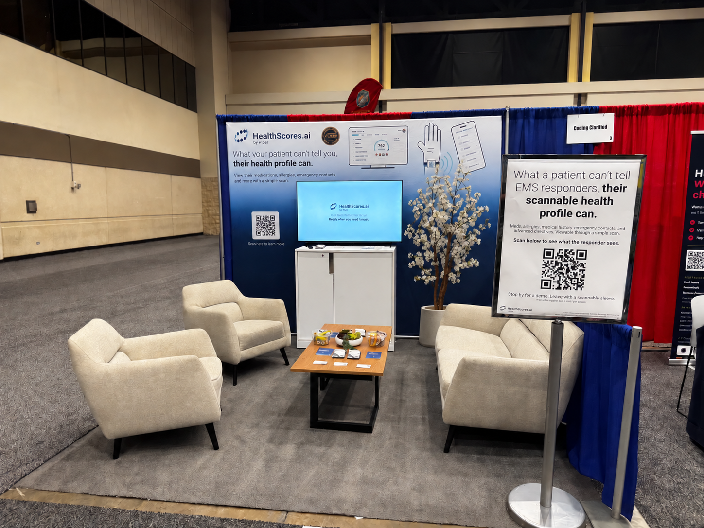 HealthScores.ai EMS World Expo booth with QR activation and patient-profile messaging