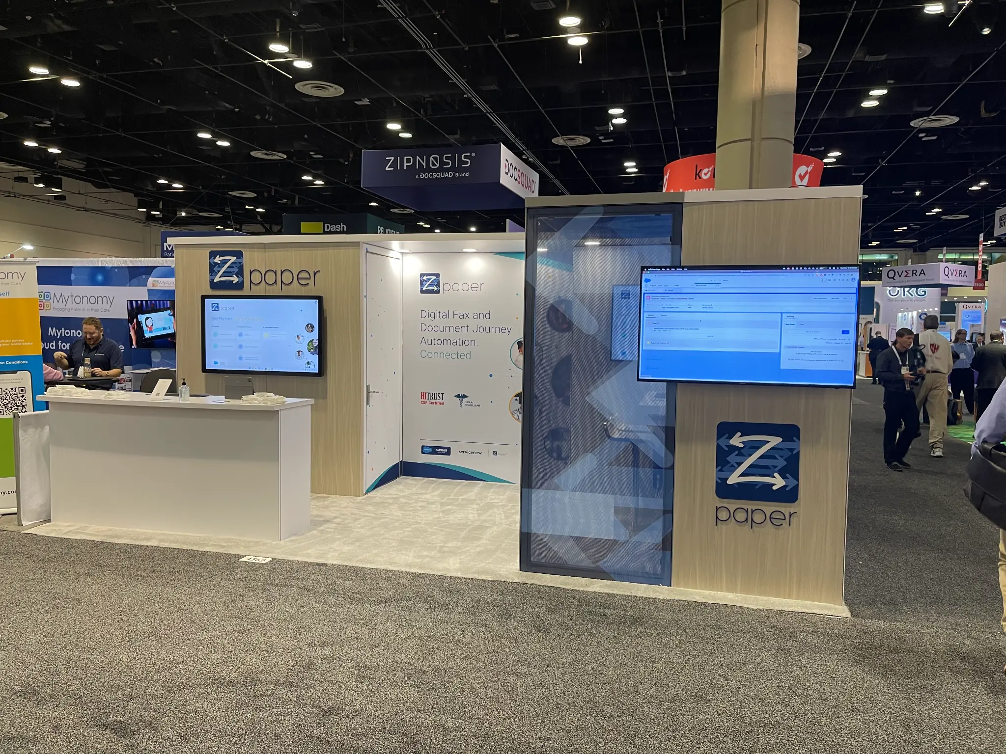zPaper conference booth with document-exchange experience and product screens